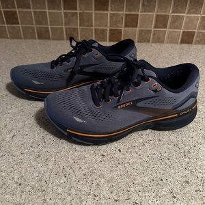 Brooks Ghost 15 Running Shoes.They are oyster and metallic orange.